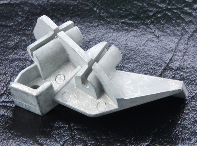 Award-winning fuel injection bracket die cast component